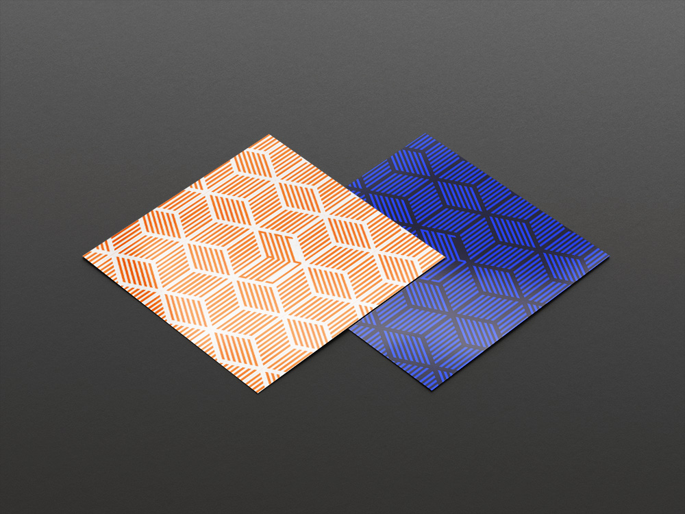 Two posters of the Dreamcast orange/white and PlayStation 2 blue/black version of the BIOS album cover. 